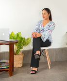 TIE FRONT DEEP NECK RUFFLE HEM TOP